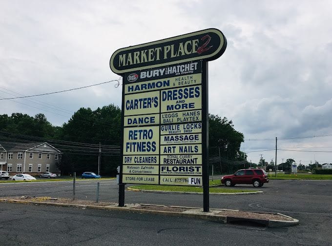 Marketplace sign for Paradise Massage in Matawan
